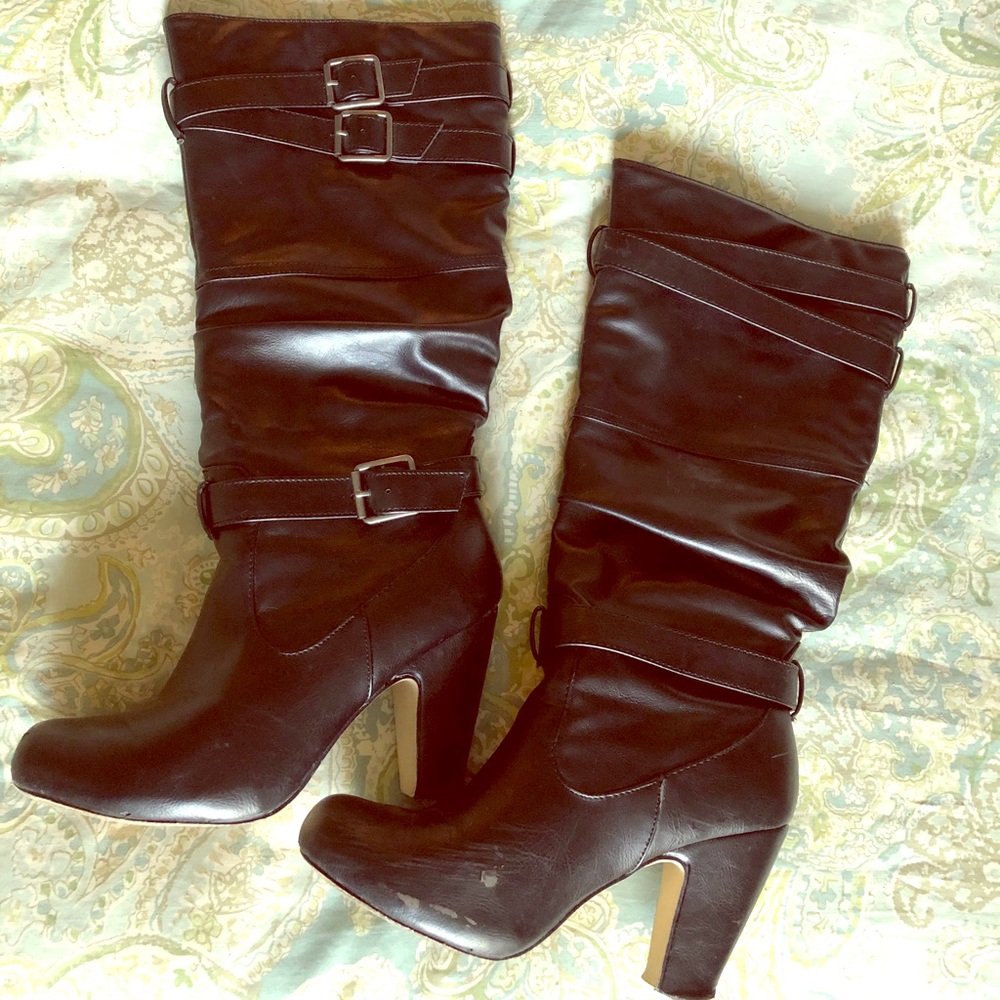 Black leather high heeled boots